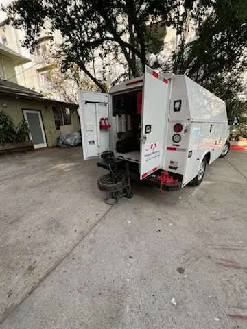 Magnet Plumbing service vehicle on-site for Grease Trap Cleaning in Armistead Gardens